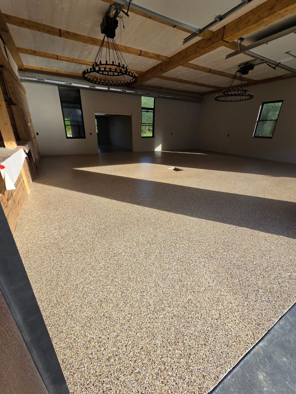 Tan and brown flake floor in a finished interior room